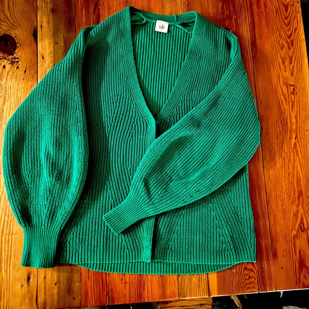 Cabi knit green cable knit cardigan with oversized sleeves.